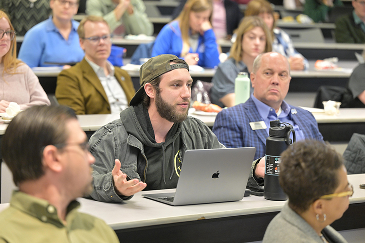 An attendee poses a question to members of an economic development panel featured Jan. 23 in the Business and Aerospace Building on Middle Tennessee State University campus in Murfreesboro, Tenn. The Jennings and Rebecca Jones Chair of Excellence in Regional and Urban Planning hosted the panel in partnership with the Rutherford County Chamber of Commerce. (MTSU photo by James Cessna)
