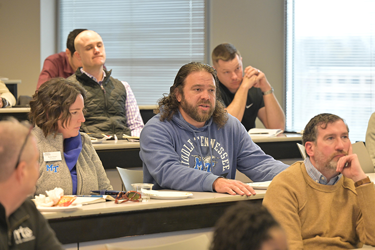 An attendee poses a question to members of the economic development panel featured Jan. 23 in the Business and Aerospace Building on Middle Tennessee State University campus in Murfreesboro, Tenn. The Jennings and Rebecca Jones Chair of Excellence in Regional and Urban Planning hosted the panel in partnership with the Rutherford County Chamber of Commerce. (MTSU photo by James Cessna)