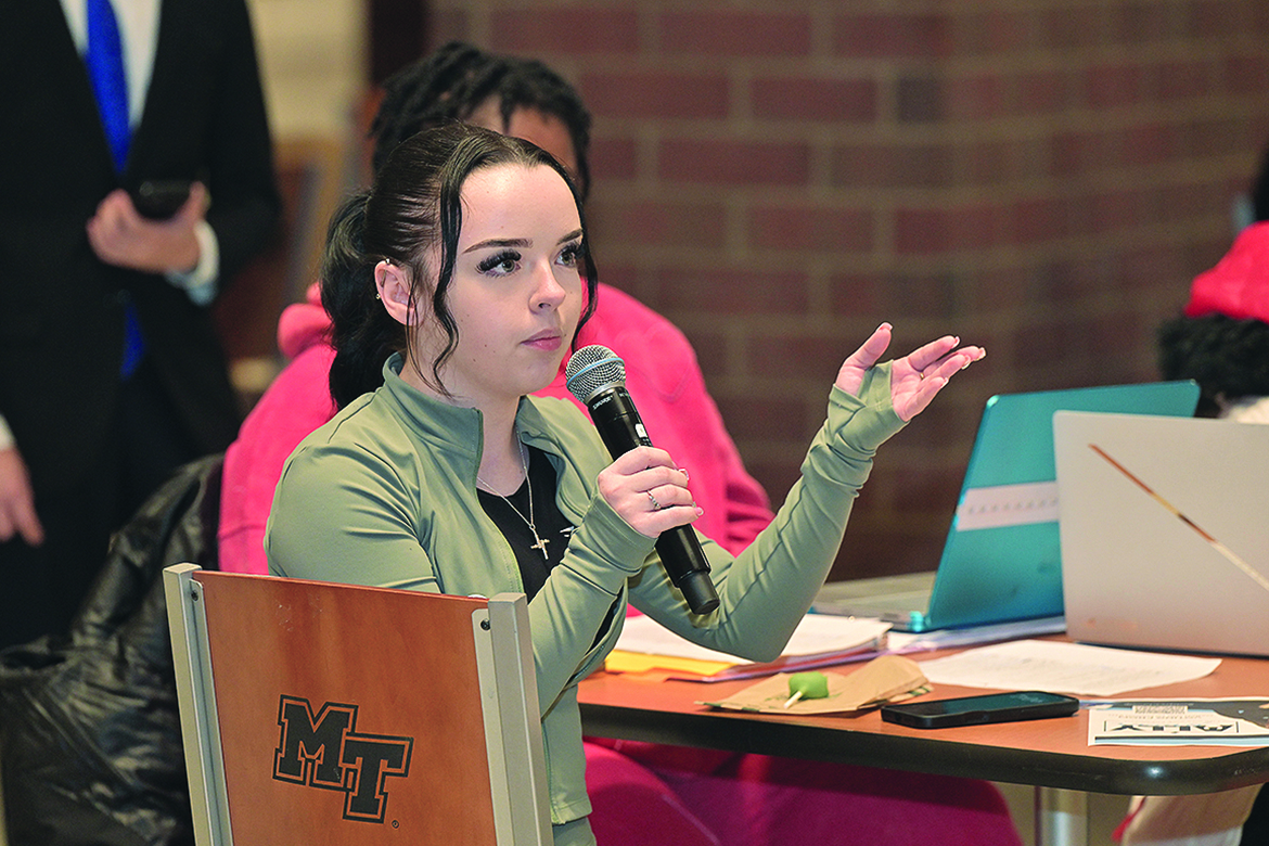 An international student at Middle Tennessee State University in Murfreesboro, Tenn., poses a question to a Student Government Association presidential candidate during a debate held in the Student Union Atrium on Monday, Feb. 23, ahead of the SGA officer election, which takes place on campus Monday-Friday, March 2-5. (MTSU photo by James Cessna)