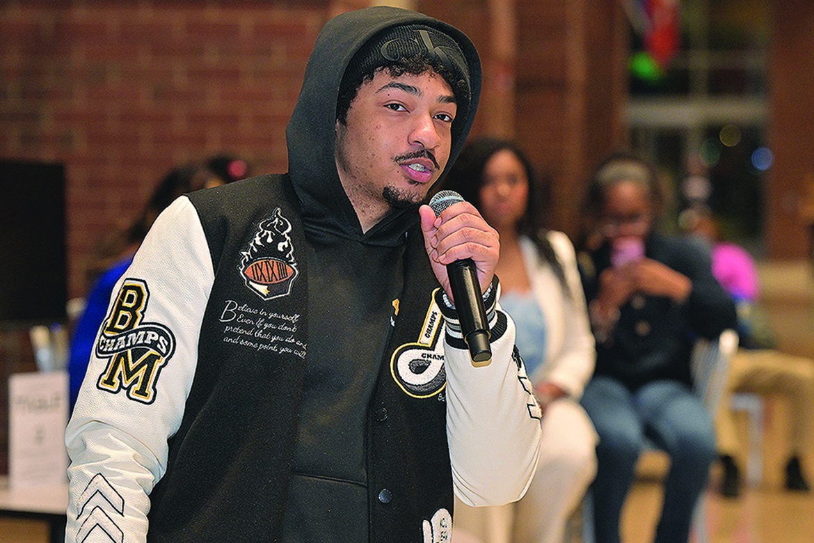 A student at Middle Tennessee State University in Murfreesboro, Tenn., poses a question to a Student Government Association presidential candidate during a debate held in the Student Union Atrium on Monday, Feb. 23, ahead of the SGA officer election, which takes place on campus Monday-Friday, March 2-5. (MTSU photo by James Cessna)