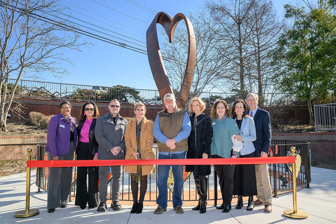 A ribbon-cutting ceremony for the “HeArt of Tennessee” sculpture created by Middle Tennessee State University art professor Michael Baggarly was held at the Discovery Center at Murfree Springs in Murfreesboro, Tenn., on Feb. 9, 2026. Pictured, from left, are MTSU College of Liberal Arts Dean Leah Tolbert Lyons; Discovery Center CEO Tara MacDougall; Baggarly; Rutherford Arts Alliance At-Large member Ginny Togrye; ironwork artist Joe Brown; artist and Rutherford Arts Alliance member Sharon Kolli; Rutherford Arts Alliance treasurer Susan Gulley; MTSU College of Liberal Arts Special Projects Coordinator and Rutherford Alliance Governance Chair Lucy Langworthy; and Mark Cannon, husband of the late Ginna Foster Cannon, an early Rutherford Alliance chair to whom the sculpture was dedicated.
