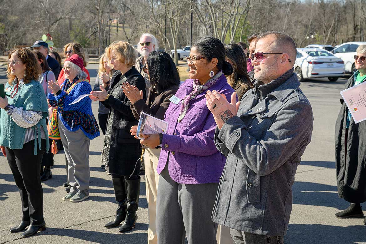 Middle Tennessee State University art professor and sculptor Michael Baggarly, right, applauds along with MTSU College of Liberal Arts Dean Leah Tolbert Lyons and other attendees at the ribbon-cutting ceremony for Baggarly’s “HeArt of Tennessee” sculpture held Feb. 9, 2026, at the Discovery Center at Murfree Springs in Murfreesboro, Tenn. (MTSU photo by J. Intintoli)