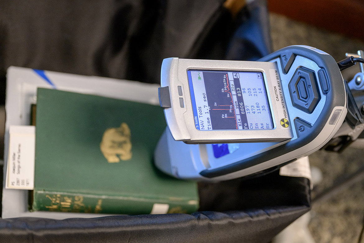 A book from the Special Collections at James E. Walker Library at Middle Tennessee State University in Murfreesboro, Tenn., undergoes testing using an X-ray fluorescence spectroscopy, or XRF, to identify and quantify toxic compounds and heavy metals found within the pigments used in many of the 19th-century books that are housed in the library’s repository for rare, unique and fragile materials. The testing — which showed the presence of arsenic — is part of the “Poisoned Pages” project made possible through a University Research and Creative Activity, or URECA, grant that funded the collaboration between the Department of Chemistry and the library. (MTSU photo by J. Intintoli)