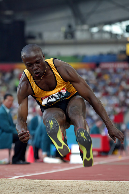 Andrew Owusu, Middle Tennessee State University professor and three-time Olympian, competes in the triple jump at the Commonwealth Games in Manchester, UK, in July 2002. (Submitted photo)