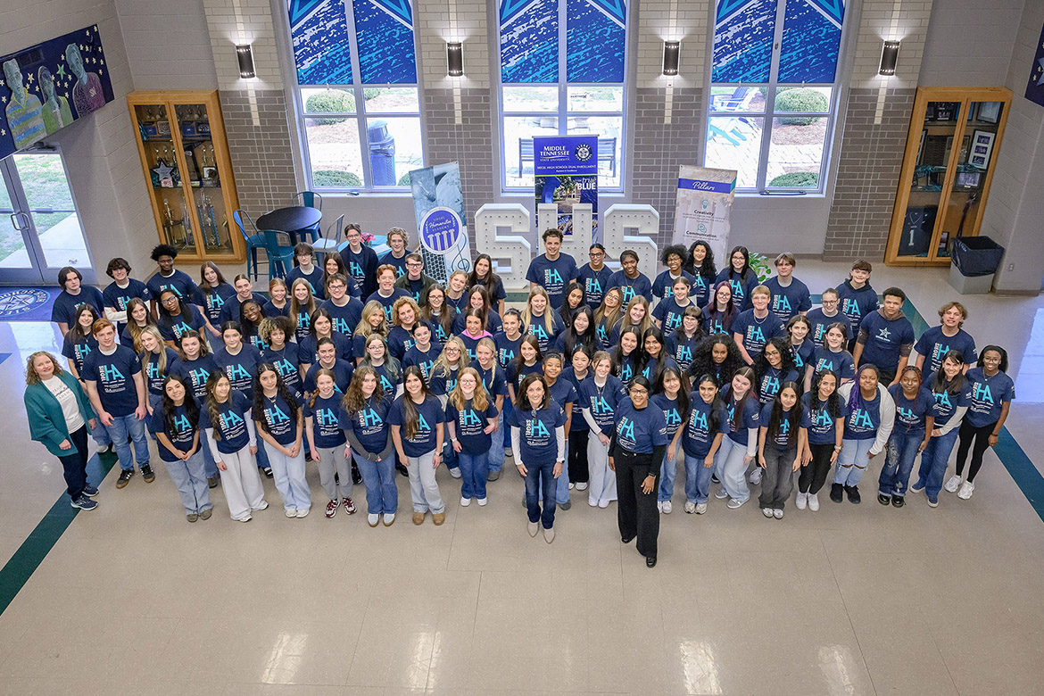 Middle Tennessee State University College of Liberal Arts Special Project Coordinator Lucy Langworthy, front center, and Dean Leah Tolbert Lyons, front right, pose for a group photo with students and faculty from Seigel High School’s Humanities Academy during a Jan. 16 event at Siegel High School in Murfreesboro, Tenn. They are wearing the newly unveiled Humanities Academy T-shirts designed by a student and provided through support from MTSU’s College of Liberal Arts and Marketing and Communications. The program connects participating high school students with humanities learning, alumni speakers, and community engagement opportunities. (Submitted photo)