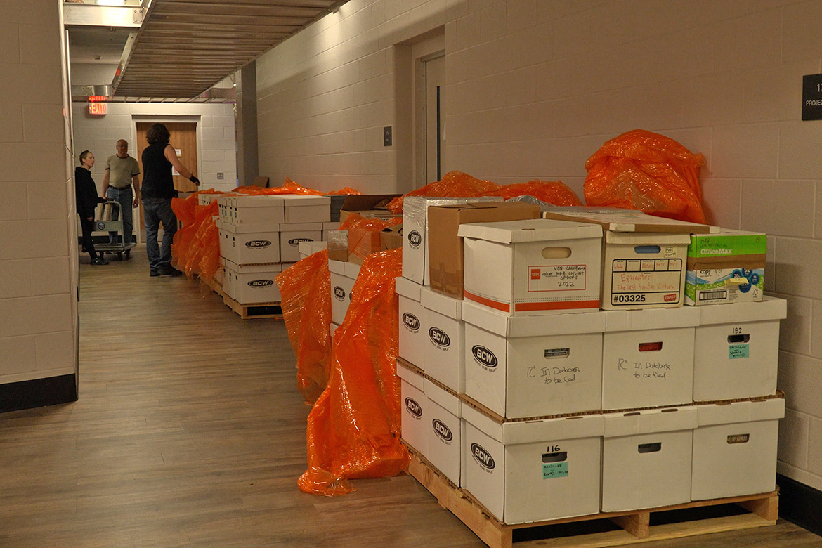Pallets of boxes of Maximum Rocknroll’s punk music archives sit inside the Bragg College of Media and Entertainment Building at Middle Tennessee State University in Murfreesboro, Tenn., after being delivered in early February, awaiting relocation to the Center for Popular Music for permanent storage and archiving. (MTSU image by Karli Sutton)