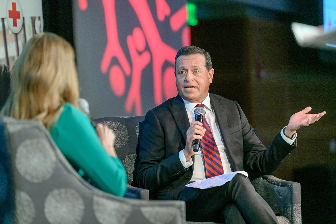 Nick Paranjape, alumnus of Middle Tennessee State University and owner of Video Story Productions, interviews American Red Cross Heart of Tennessee Chapter Volunteer Hero Terry Smith at the nonprofit’s annual Heroes Luncheon held Thursday, March 12, at the Student Union Ballroom on campus in Murfreesboro, Tenn. (MTSU photo by J. Intintoli)