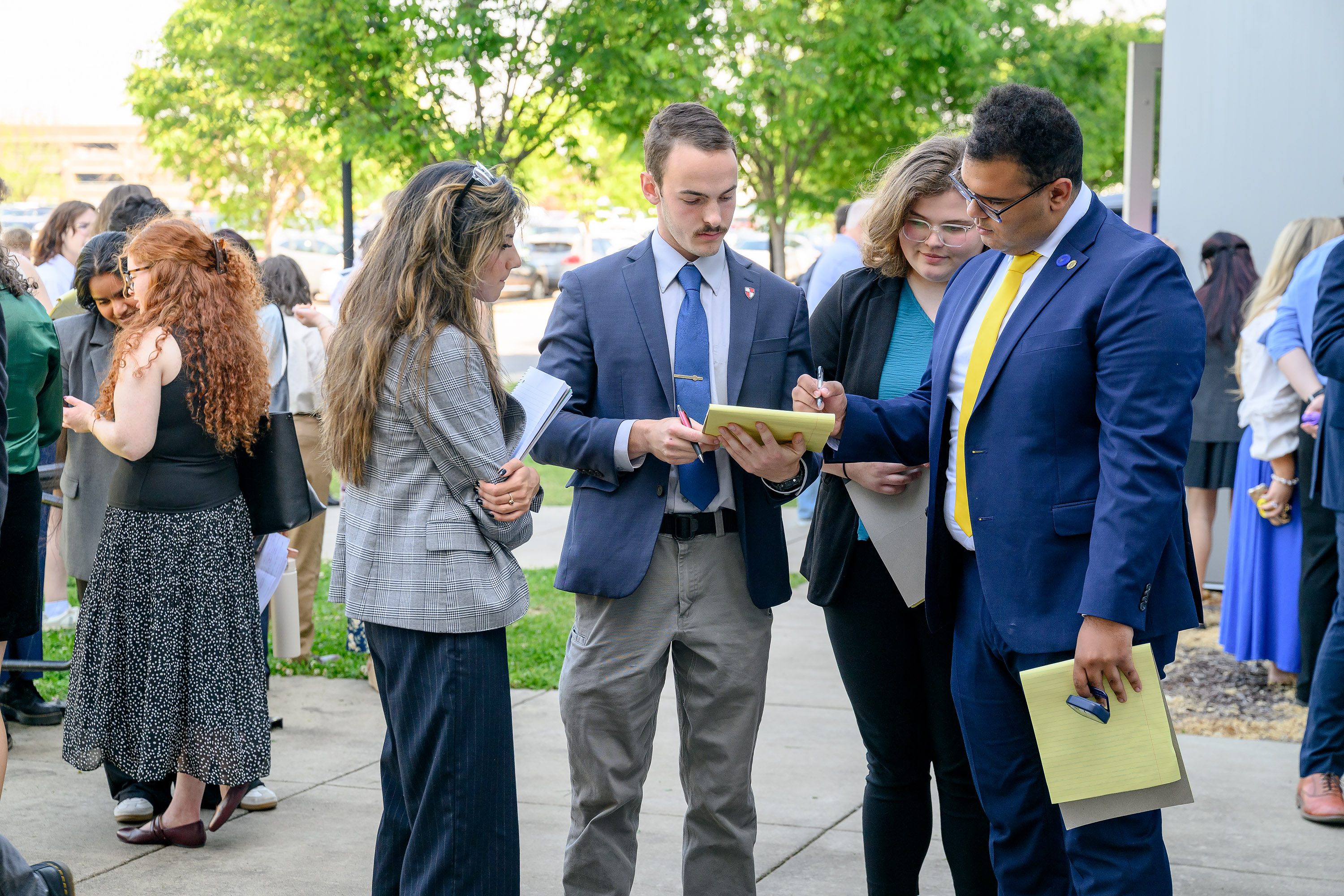 Competitors in the International Public Debate Team National Championships and Convention, hosted April 10-13 by Middle Tennessee State University on campus in Murfreesboro, Tenn., go over strategies outside the Academic Classroom Building on campus. MTSU’s Blue Raider Debate Team hosted 54 colleges and over 400 students for the four-day debate competition. (MTSU photo by J. Intintoli)