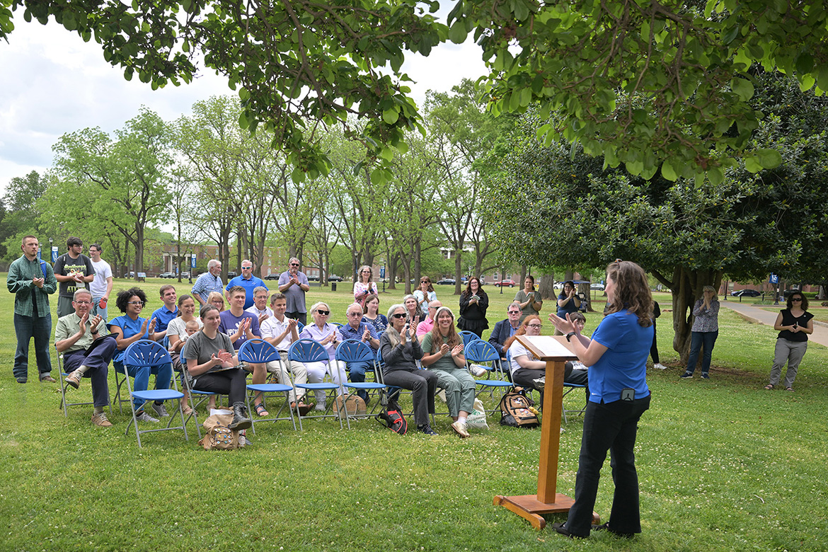 Kristin England, sustainability manager for the Center for Energy and Sustainability at Middle Tennessee State University in Murfreesboro, Tenn., talks to a crowd gathered Thursday, April 16, near Walnut Grove on campus to celebrate the unveiling of the newly designated Level II Arboretum. Certified by the Tennessee Urban Forestry Council, 73 trees have been tagged and mapped across the 500-acre campus. (MTSU photo by James Cessna)