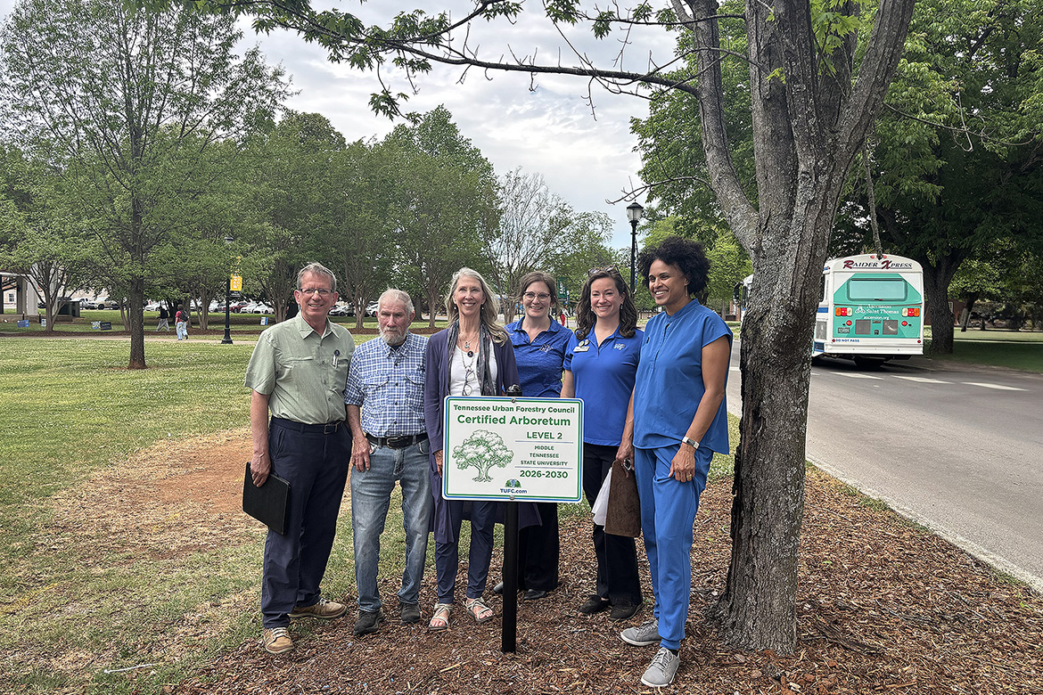 Middle Tennessee State University in Murfreesboro, Tenn., unveiled the newly designated Level II Arboretum on campus, certified by the Tennessee Urban Forestry Council. A collaborative effort went into tagging and mapping 73 trees across the 500-acre campus, and team members present at the unveiling held Thursday, April 16, include, from left, Neal Letson, forestry council volunteer; former groundskeeper Larry Sizemore; Kim Sadler, Department of Biology professor emeritus; Kristen Hargis, assistant manager for the MTSU Center for Energy and Sustainability, or CES; Kristin England, CES manager; and Danielle Brown, lecturer in the Department of Biology. (MTSU photo by Nancy DeGennaro)