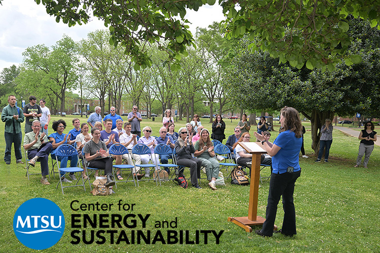 Kristin England, sustainability manager for the Center for Energy and Sustainability at Middle Tennessee State University in Murfreesboro, Tenn., talks to a crowd gathered Thursday, April 16, near Walnut Grove on campus to celebrate the unveiling of the newly designated Level II Arboretum. Certified by the Tennessee Urban Forestry Council, 73 trees have been tagged and mapped across the 500-acre campus. (MTSU photo by James Cessna)