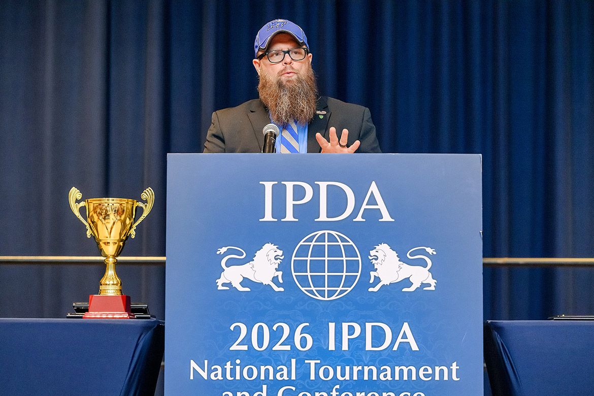 Pat Richey, Blue Raider Debate Team coach at Middle Tennessee State University in Murfreesboro, Tenn., gives the opening address to the crowd gathered in the James Union Building on campus at the International Public Debate Association National Championships and Convention awards ceremony on Monday, April 13. (MTSU photo by J. Intintoli)