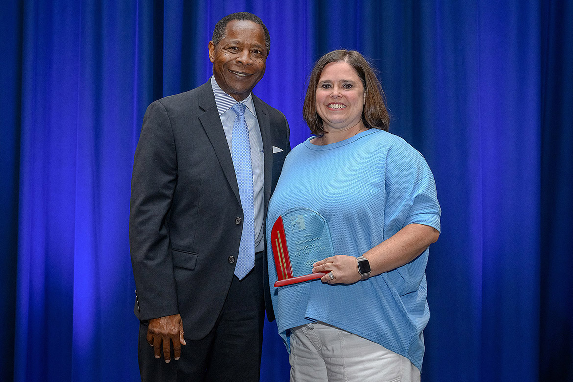Middle Tennessee State University President Sidney A. McPhee, left, presents the 2025-26 Administrative Employee of the Year Award to Jackie Victory, director of Campus Activities and Strategic Marketing in the Office of Student Organizations and Service, at the annual Employee Recognition Awards held Wednesday, April 22, in the James Union Building on campus in Murfreesboro, Tenn. (MTSU photo by Andy Heidt)