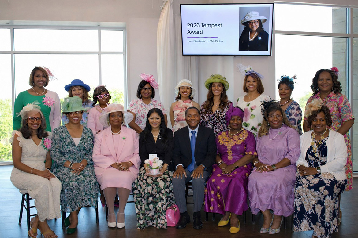 The American Association for University Women Murfreesboro Chapter announced the renaming of its flagship Tempest Award in honor of the late Elizabeth “Liz” McPhee, wife of Middle Tennessee State University President Sidney A. McPhee, during the biennial EqualiTEA fundraiser and scholarship presentation held April 9 at The View at Fountains in Murfreesboro, Tenn. Members of Alpha Kappa Alpha, Pi Nu Omega Chapter, gather around President McPhee, center right, and his daughter, Seneca McPhee, center left, following the presentation of the award given in memory of their late sorority sister. (MTSU photo by Jenn Caputo)
