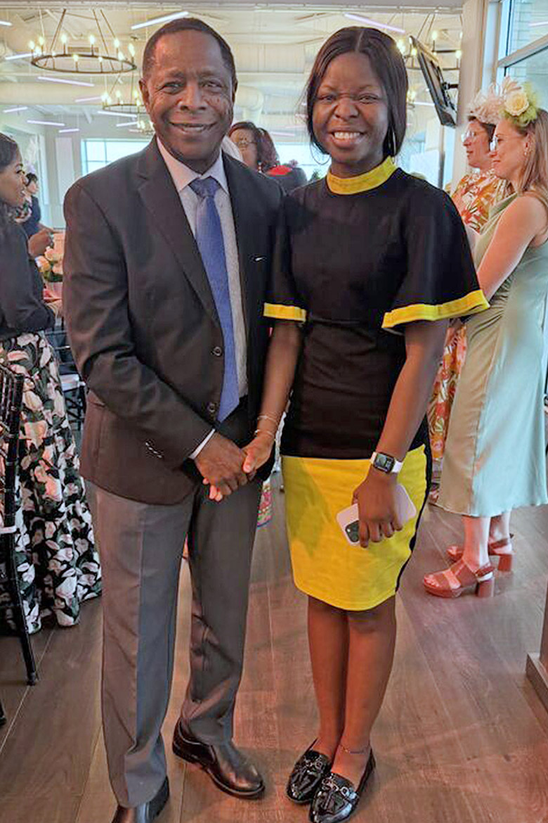 Middle Tennessee State University President Sidney A. McPhee, left, stands with Ifeoluwa Deborah Osungbure, a Ph.D. student at MTSU in Murfreesboro, Tenn., who was presented the Butler Fouts-Graduate Scholarship at the recent EqualiTEA high tea fundraiser hosted April 9 by the Middle Tennessee Fund for Women and Girls and the American Association of University Women Murfreesboro Chapter. (MTSU photo by Kristen Keene)