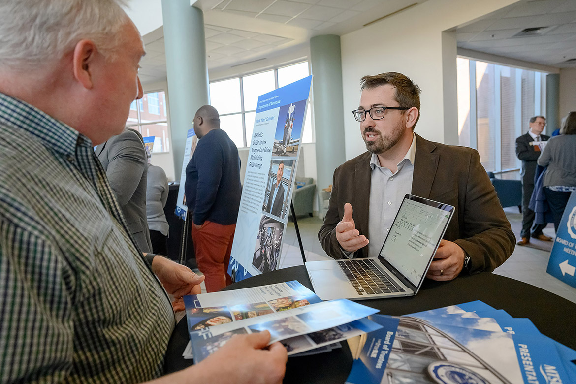 Collin McDonald, assistant professor in the Aerospace Department at Middle Tennessee State University in Murfreesboro, Tenn., explains a project at the Faculty Showcase held in March at Miller Education Center following the quarterly MTSU Board of Trustees meeting. (MTSU photo by J. Intintoli)