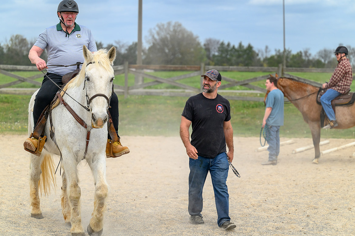Bruce, a participant in the Middle Tennessee State University Center for Equine Recovery for Veterans, works with volunteer peer mentor Dan Tibitoski, a U.S. Navy veteran and program graduate, during a recent therapy session at the MTSU Horse Science Center in Murfreesboro, Tenn. The 10-week program is made possible through a partnership with MTSU and the VA Tennessee Valley Healthcare System to help veterans in their recovery journeys. (MTSU photo by J. Intintoli)