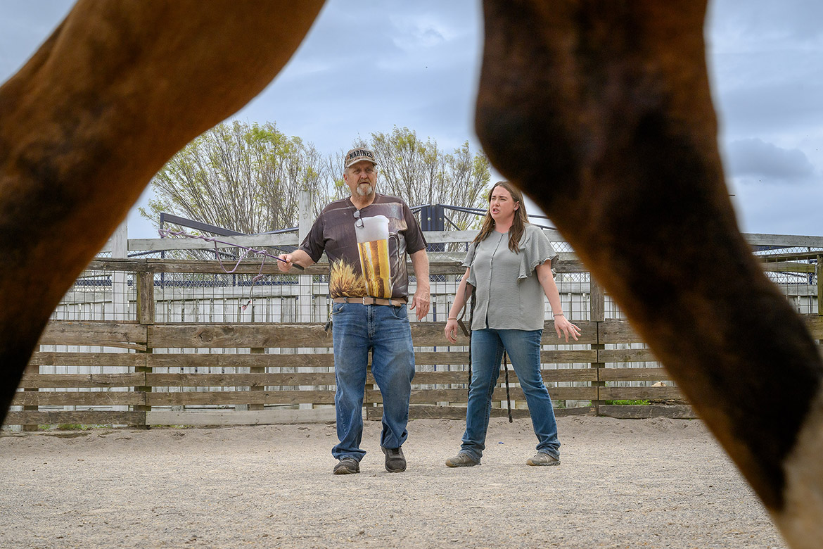 Andrea Rego, right, coordinator of the Center for Equine Recovery for Veterans, or CERV, and a senior instructor in the School of Agriculture at Middle Tennessee State University in Murfreesboro, Tenn., and peer mentor Wade Hinson with the VA Tennessee Valley Healthcare System give instructions to participants in the MTSU Center for Equine Recovery for Veterans program during a recent session. The 10-week program is possible through a partnership with MTSU and the VA to help veterans in their recovery journeys. (MTSU photo by J. Intintoli)