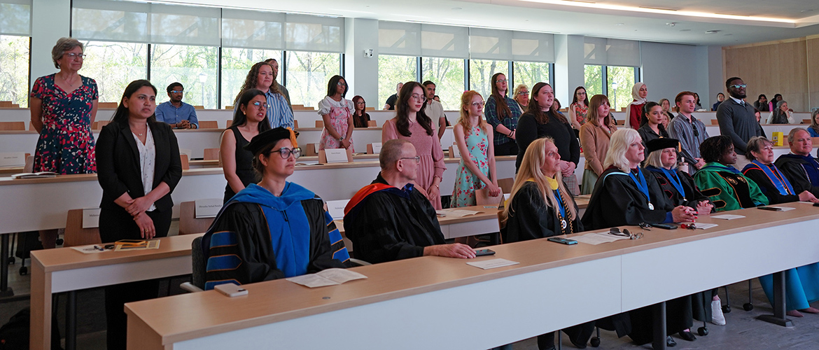 Spring 2026 initiates into the Middle Tennessee State University Chapter 246 of the Honor Society of Phi Kappa Phi recite the Society’s affirmation of membership at the initiation ceremony at the Paul W. Martin Sr. Honors Building. (MTSU photo by Robin E. Lee)
