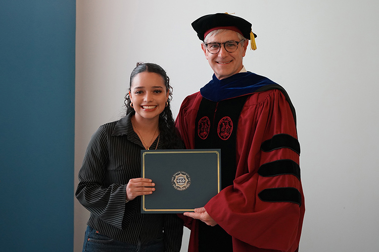 Middle Tennessee State University student and Phi Kappa Phi initiate Aniya Dean, left, is shown with College of Basic and Applied Sciences Dean Greg Van Patten at the Spring 2026 initiation ceremony at the Paul W. Martin Sr. Honors Building. (MTSU photo by Robin E. Lee)