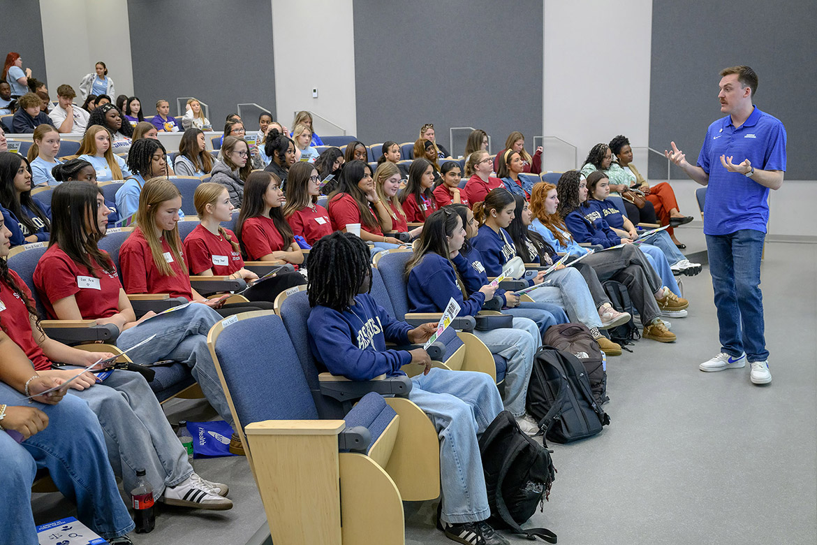 Chipper Smith, Department of Health and Human Performance faculty member at Middle Tennessee State University in Murfreesboro, Tenn., welcomes high school students from Rutherford County Schools for the inaugural Public Health Symposium held on campus in late March. Students were given a snapshot of careers that extend beyond traditional roles in medicine. (MTSU photo by J. Intintoli)