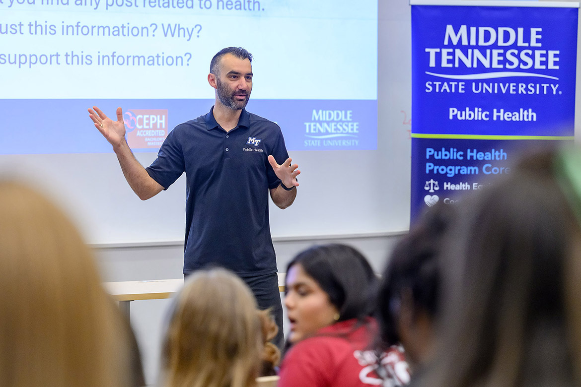 Kahler Stone, associate professor in the Department of Health and Human Performance at Middle Tennessee State University in Murfreesboro, Tenn., talks to high school students from Rutherford County Schools about health literacy during the inaugural Public Health Symposium held on campus in late March. Students were given a snapshot of careers that extend beyond traditional roles in medicine. (MTSU photo by J. Intintoli)