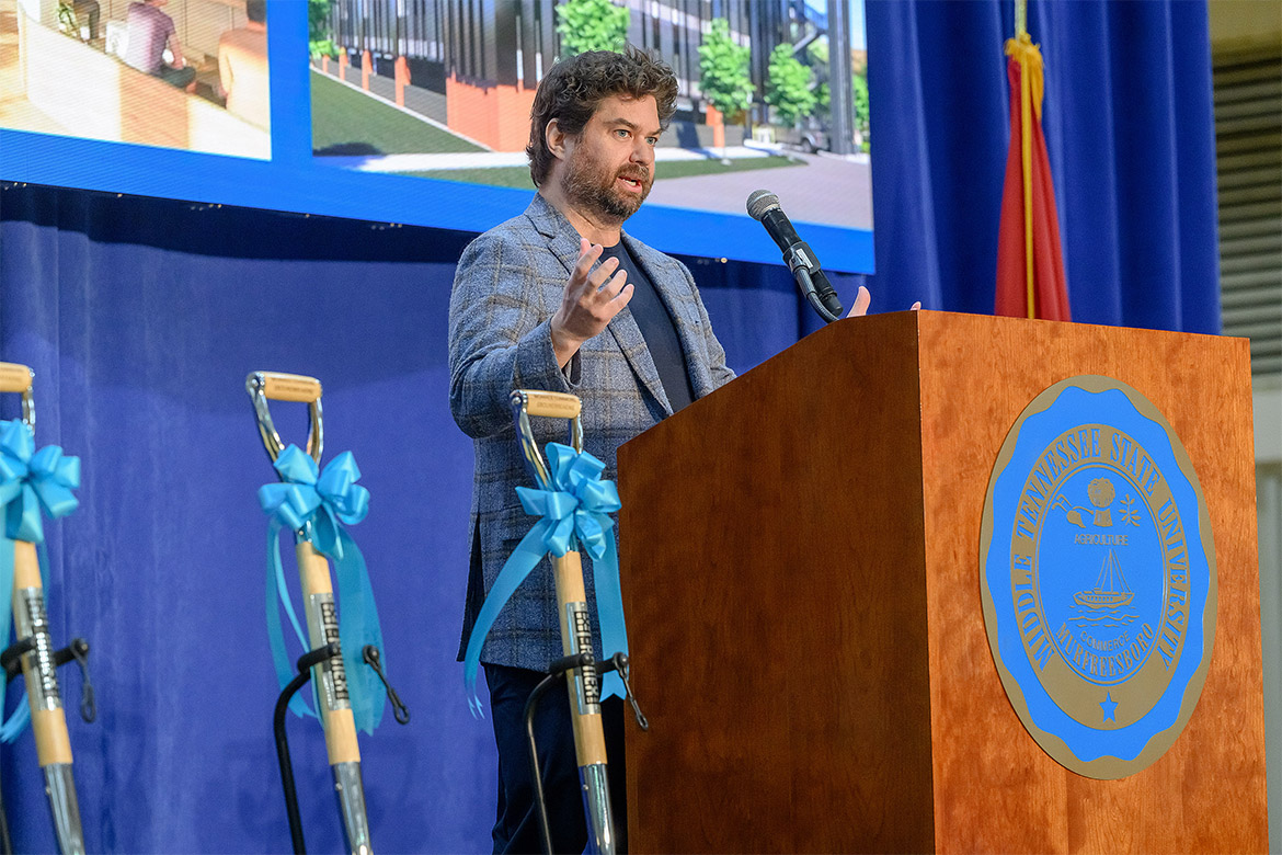Tom Tomaszewski, president of The Annex Group, speaks on Wednesday, April 8, during the groundbreaking ceremony for the Womack Commons student housing project held inside the Middle Tennessee State University Recreation Center on campus in Murfreesboro, Tenn. The project is part of a public-private partnership with MTSU and is expected to be completed in summer 2027. (MTSU Photo by Andy Heidt)