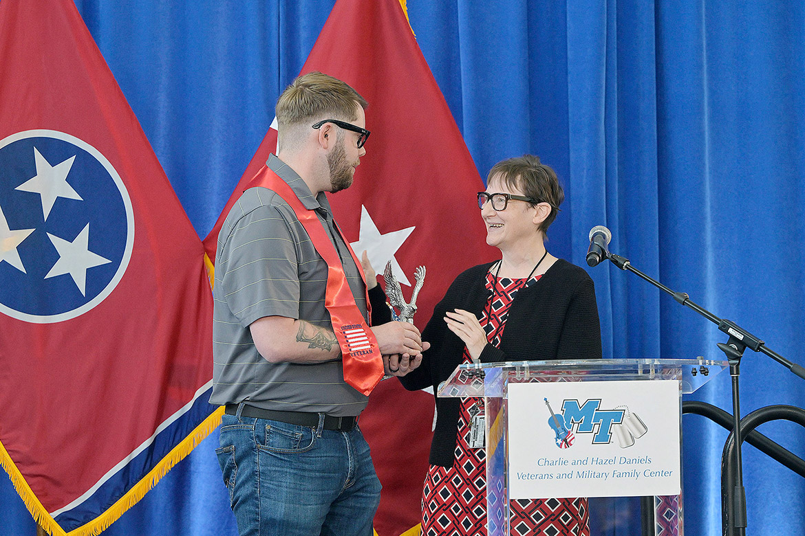 Laurie Witherow, vice provost for enrollment services at Middle Tennessee State University in Murfreesboro, Tenn., presents management and leadership major Jacob Kimbrough with the Veterans Leadership Award at the 33rd Graduating Veterans Stole Ceremony held Thursday, May 7, 2026, at Miller Education Center. (MTSU photo by Andy Heidt)
