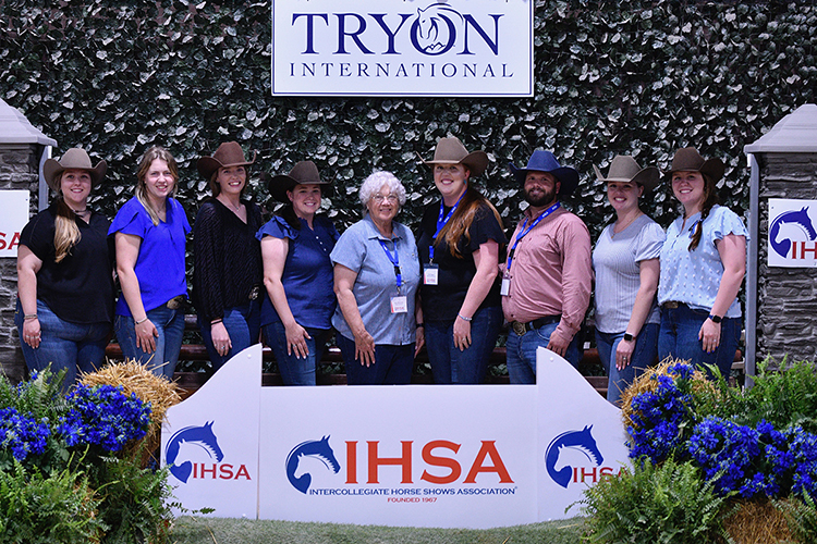 Anne Brzezicki, center, Middle Tennessee State University’s prolific former director of Equestrian programs, equestrian team coach and horse science instructor, takes a group photo with MTSU alumni who went on to become college riding coaches, including Ariel Higgins, right of Brzezicki, MTSU’s current Equestrian programs director, at the Intercollegiate Horse Show Association’s 2025 National Championships at the Tryon International Equestrian Center in Mill Spring, N.C., in May 2025. (Submitted photo)