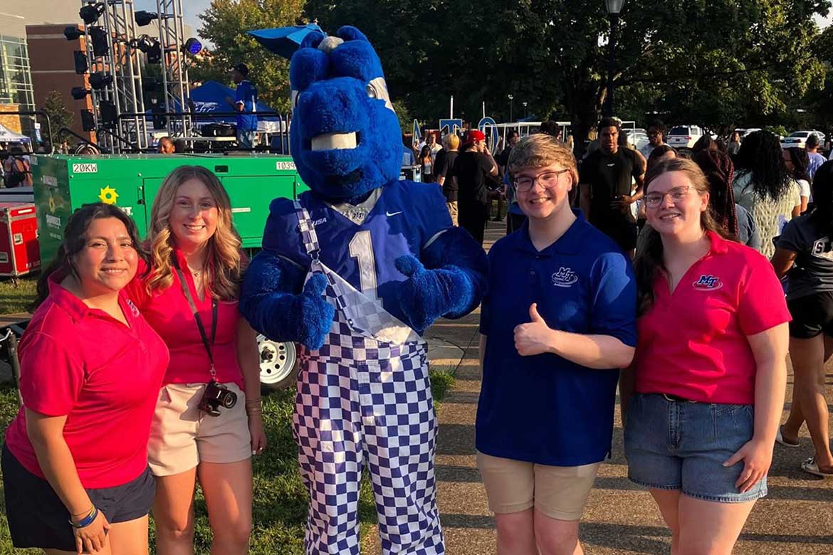 Callie Welch, far right, poses for a photo with friends and Middle Tennessee State University mascot Lightning (Photo submitted)
