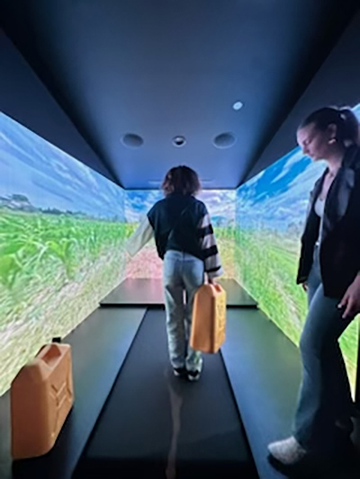 Two students with the Siegel Humanities Academy at Siegel High School in Murfreesboro, Tenn., visit the immersive storytelling exhibit at the Experience Lab by Charity: Water in Franklin, Tenn.