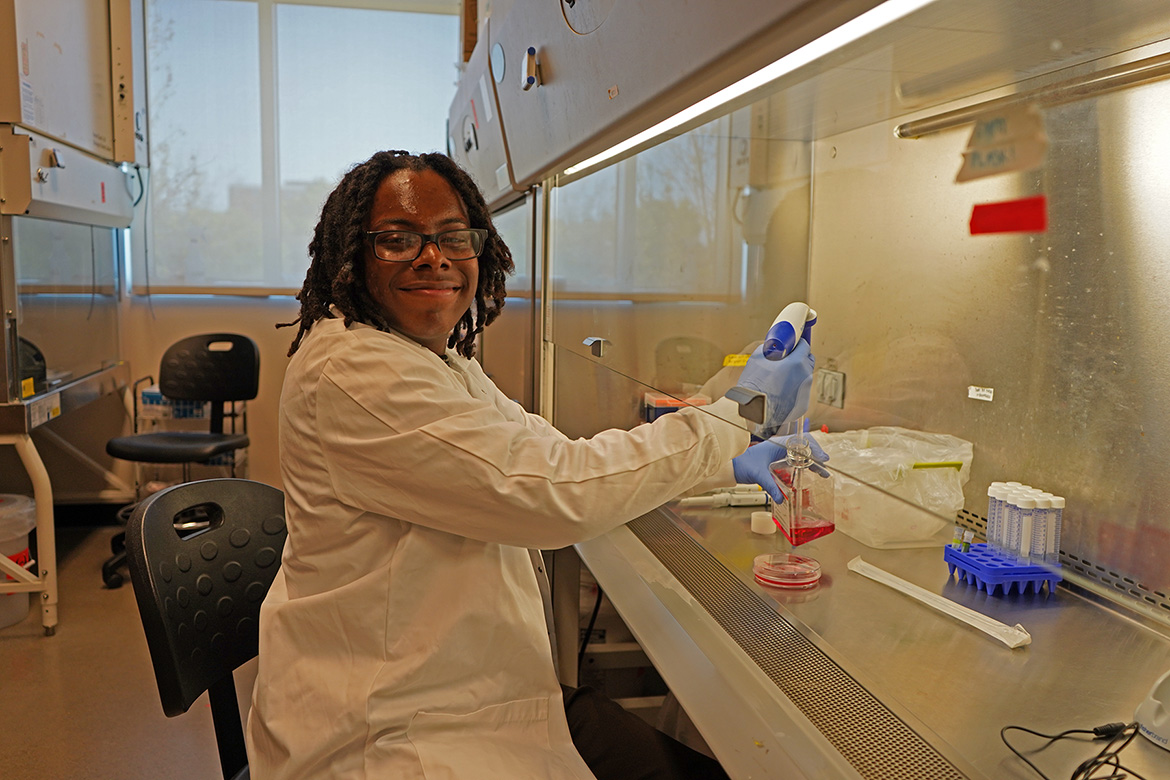 Student Donye Asberry, a biochemistry major, working inside an MTSU science lab.