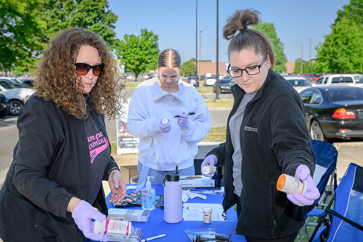 Tabby Ragland, left, director of Campus Pharmacy at Middle Tennessee State University in Murfreesboro, Tenn., Ariel Todd with Prevention Coalition for Success, center, and fourth-year Lipscomb University pharmacy student Ariel Todd sort through discarded and outdated medications that were dropped off for safe disposal at the biannual MTSU Drug-Vape Take-Back event held on campus Thursday, April 23. The event is hosted biannually by MTSU as part of the Drug Enforcement Administration’s national initiative to provide a safe, convenient and environmentally responsible way to dispose of unneeded medications while also educating about the abuse of prescription drugs. (MTSU photo by J. Intintoli)