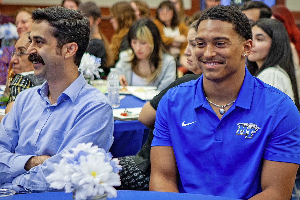 20260447D 034.JPG Elijah Carney, a senior philosophy and religious studies major at Middle Tennessee State University in Murfreesboro, Tenn., right, looks on as awards are presented during the annual College of Liberal Arts awards ceremony, April 9, 2026. Carney was recognized as the Department of Philosophy and Religious Studies Outstanding Student of the Year. (MTSU photo by J. Intintoli)