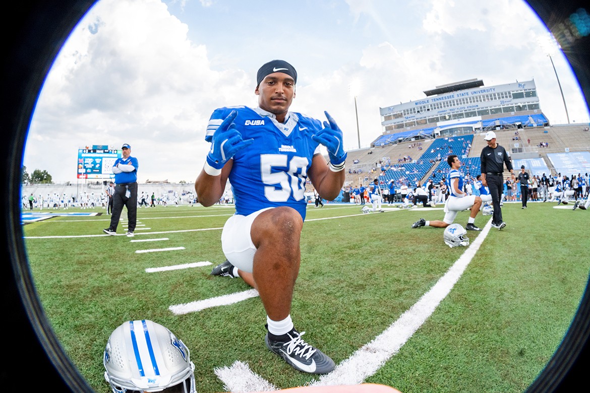 Elijah Carney, a senior philosophy and religious studies major at Middle Tennessee State University in Murfreesboro, Tenn., and linebacker for the Blue Raiders football team poses for a photo during pre-game stretches. (Submitted photo)