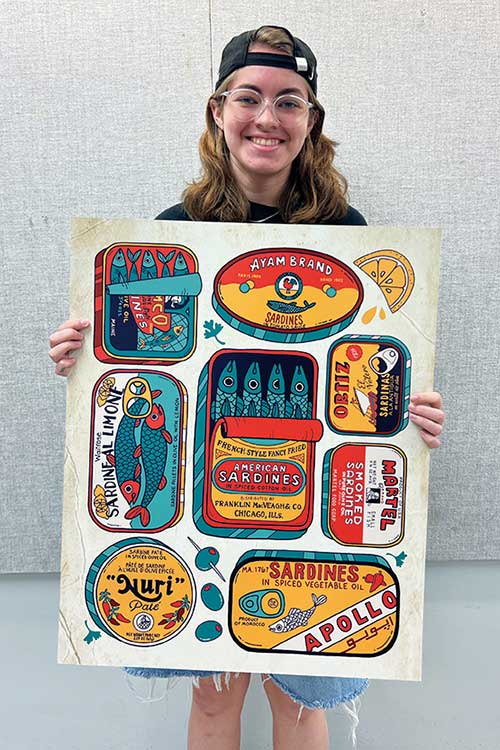 Lila Gordon, a senior graphic design major at Middle Tennessee State University, holds up a print of her award-winning illustration titled “A Little Fishy.” Out of 4,550 entries from around the world, Gordon’s submission was one of only 216 that made the cut in the 2026 Society of Illustrators’ international competition to be displayed in their gallery in New York.  (Submitted photo)