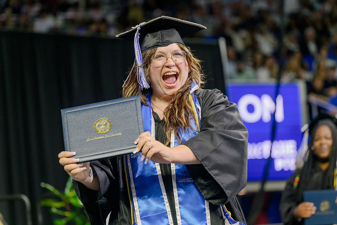 A Class of 2026 graduate shows off her diploma cover on Saturday, May 9, during the morning commencement ceremony held inside Murphy Center at Middle Tennessee State University in Murfreesboro, Tenn. (MTSU photo by J. Intintoli)
