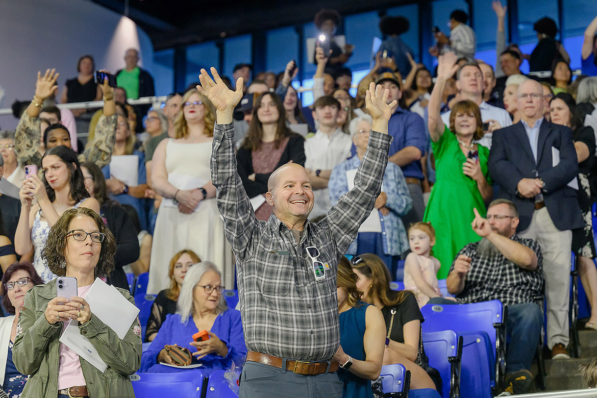 Family members and supporters of Class of 2026 graduates wave from the stands during the morning commencement ceremony held Saturday, May 9, inside Murphy Center at Middle Tennessee State University in Murfreesboro, Tenn. (MTSU photo by James Cessna)