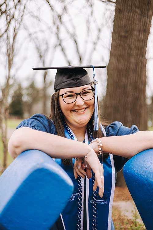 Savanah Gill poses for graduation photos at the horseshoe on Middle Tennessee State University's campus in Murfreesboro, Tenn. (Photo submitted)
