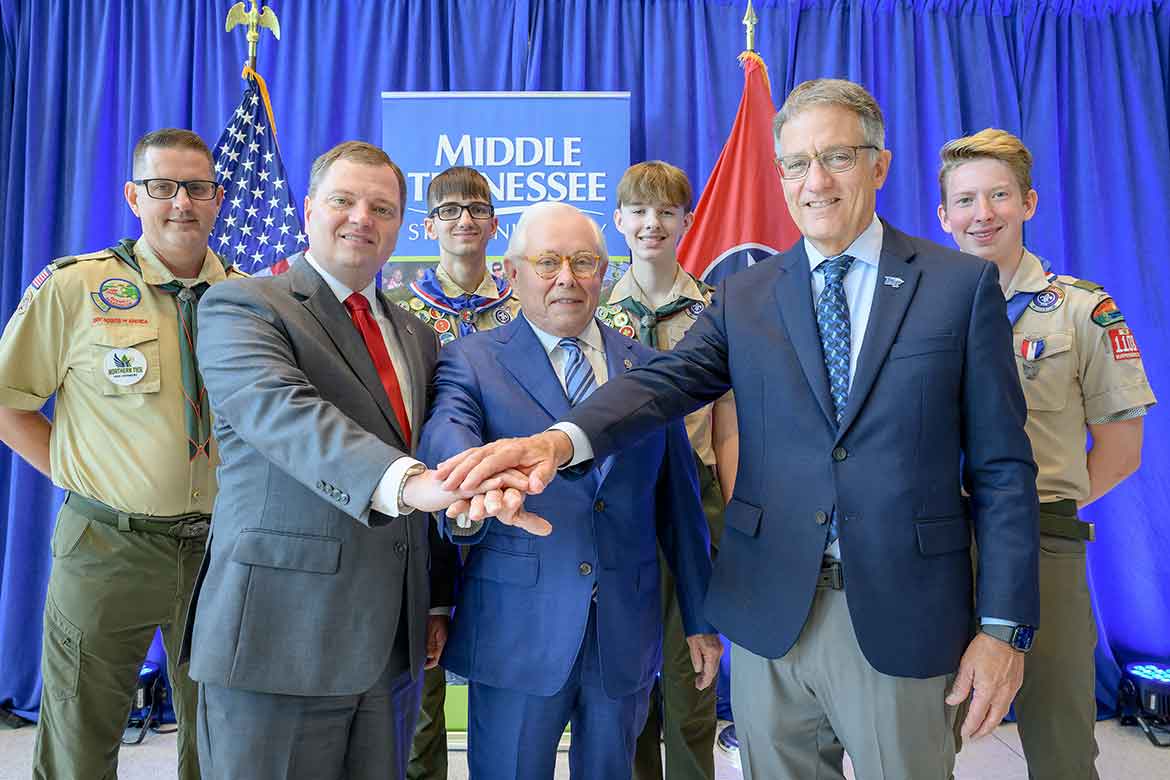Pictured in front from left are Council Scout Executive and CEO Robert Johnson; MTSU Board of Trustees member J.B. Baker, a former Council president and an Eagle Scout; and university Provost Mark Byrnes after renewing a partnership between Middle Tennessee State University and the Middle Tennessee Council of Scouting America.  Pictured back row, from left, are MTSU Vice Provost Brian Hinote, an adult Scouting leader with Troop 1108 in Murfreesboro, Tenn., and three Scouts. (MTSU photo)