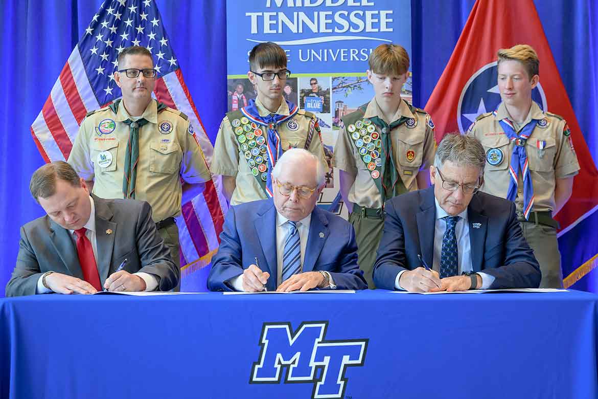 Middle Tennessee State University renewed its longstanding partnership with the Middle Tennessee Council of Scouting America during an on-campus ceremony. Seated front row, from left, are Council Scout Executive and CEO Robert Johnson; MTSU Board of Trustees member J.B. Baker, a former Council president and an Eagle Scout; and university Provost Mark Byrnes. Pictured back row, from left, are MTSU Vice Provost Brian Hinote, an adult Scouting leader with Troop 1108 in Murfreesboro, Tenn., and three Scouts. (MTSU photo)