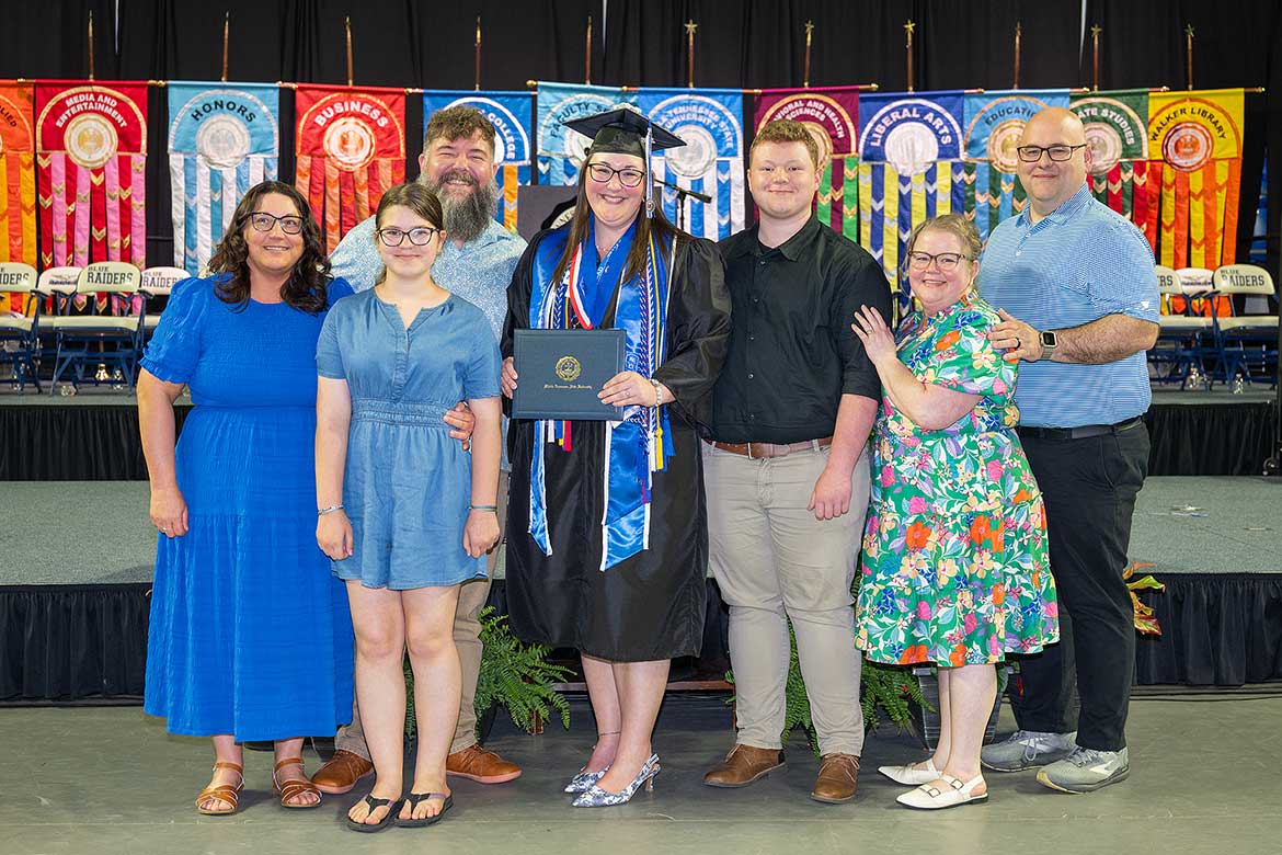Savanah Gill pictured in the center poses with her family after her graduation ceremony from Middle Tennessee State University on Saturday, May 9, 2026. (Photo by Cat Curtis Murphy)