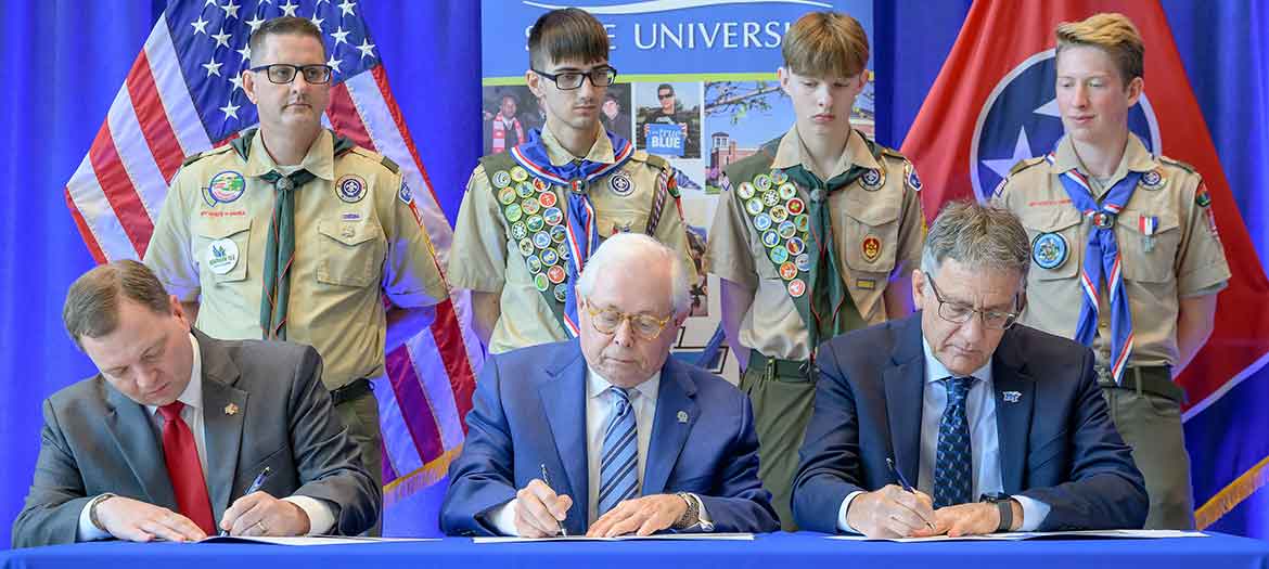 Middle Tennessee State University renewed its longstanding partnership with the Middle Tennessee Council of Scouting America during an on-campus ceremony. Seated front row, from left, are Council Scout Executive and CEO Robert Johnson; MTSU Board of Trustees member J.B. Baker, a former Council president and an Eagle Scout; and university Provost Mark Byrnes. Pictured back row, from left, are MTSU Vice Provost Brian Hinote, an adult Scouting leader with Troop 1108 in Murfreesboro, Tenn., and three Scouts. (MTSU photo)