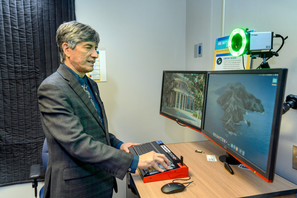 Carlos Coronel, director of the Jones College of Business IT Resources, works inside the Business and Aerospace Building in this October 2020 file photo. Coronel played a key role in helping train faculty to make the pivot to remote instruction due to coronavirus pandemic. (MTSU photo by J. Intintoli)