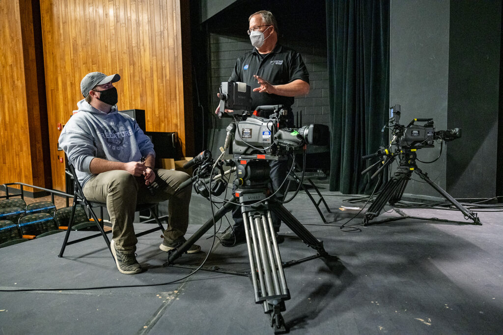 MTSU Department of Media Arts professor Robert "Bob" Gordon Jr. standing, talks with junior J.J. Blanton on the stage of Tucker Theatre as his students prepare to record the MTSU Dance Theatre's 2020 Fall Dance Concert for broadcast Saturday, Nov. 21. (MTSU photo by Andy Heidt)