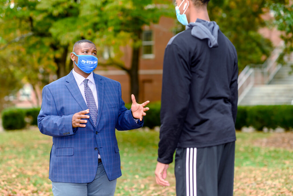Travis Strattion, Student Success Assistant Manager of Scholars Academy with student Kalen Hodges. (Photo: J. Intintoili)