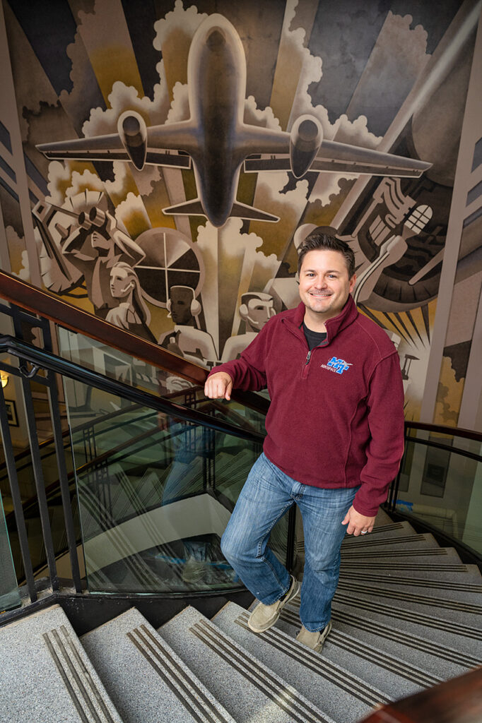 Tyler Babb, Professional Pilot Concentration Coordinator, Aerospace faculty in and around the Business and Aerospace Building. (Photo: Andy Heidt)