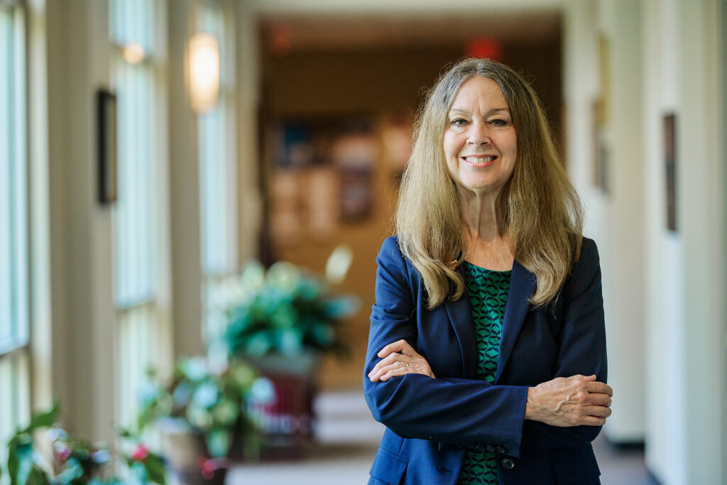 Mary Evins, History Faculty, in and around Paul W. Martin, Sr. Honors College Building. (Photo: Andy Heidt)