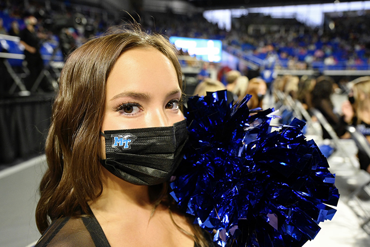 An MTSU cheerleader shows off her MT mask before the 2021 University Convocation held Saturday, Aug. 21, at Murphy Center. As part of the university’s COVID-19 safety measures, masks are required indoors. (MTSU photo by J. Intintoli)