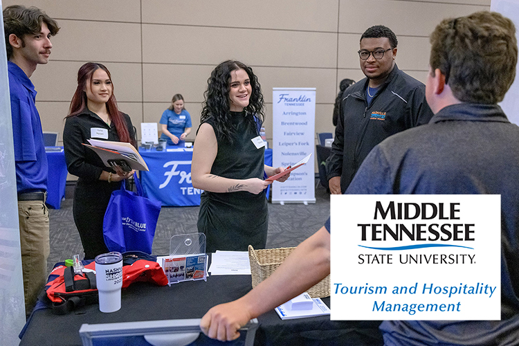 Emily Tichota, center, and Rachel Nguyen, second from left, both Tourism and Hospitality Management program majors at Middle Tennessee State University in Murfreesboro, Tenn., talk with Nashville Shores representatives at the 2025 Tourism and Hospitality/Leisure and Sport Management Career Fair held in the Student Union Ballroom on campus. This year’s event — open to MTSU students and alumni — is set for Tuesday, Feb. 24, in the ballroom. (MTSU file photo by J. Intintoli)